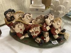 A Grogg style rugby players pottery piece, 1 arm a/f and some chips to paint