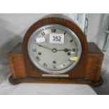 A vintage mantel clock in working order.
