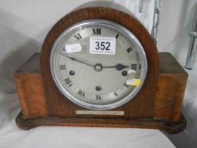 A vintage mantel clock in working order.