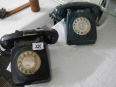 Two vintage dial telephones.