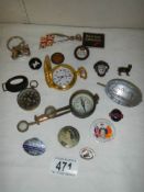A mixed lot of badges, compasses etc.,