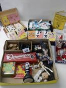 A mixed lot including playing cards, dolls etc.,