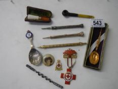 A mixed lot including propelling pencils, spoons etc.,