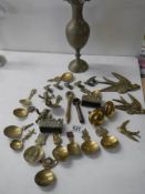 A mixed lot of caddy spoons & brass items etc.