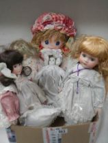 A quantity of collectors dolls.