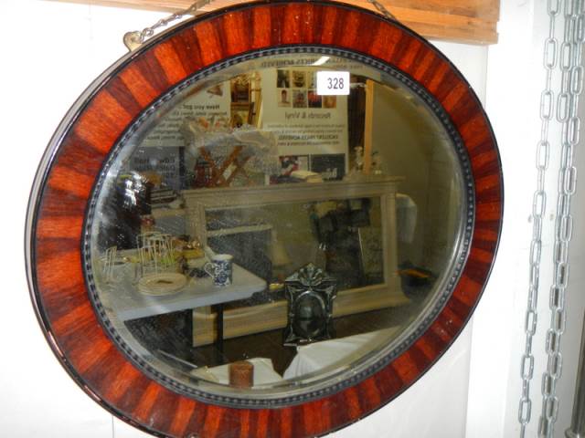 An oval framed mirror, COLLECT ONLY.
