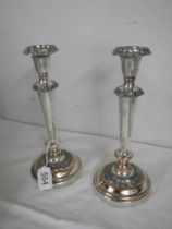 A pair of Victorian Sheffield plate candlesticks.