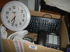 A mixed lot including telephones, clock, keyboard etc.,