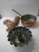 A copper saucepan, a cockerel jelly mould and a cake mould.