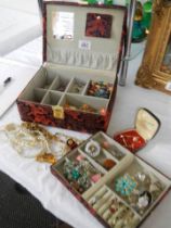 A jewellery box and costume jewellery.