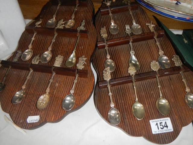 Two spoon racks with collector's spoons.