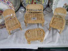 A miniature wicker suite for a dolls house.