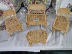 A miniature wicker suite for a dolls house.