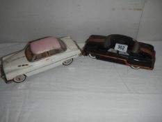Two vintage tin plate cars.