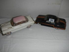 Two vintage tin plate cars.