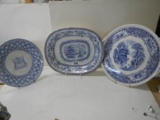 Three old blue and white plates.