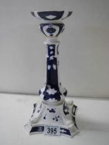 A blue and white porcelain candlestick.