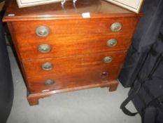 A four drawer mahogany chest with string inlay, COLLECT ONLY.