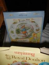 A boxed Royal Doulton Beatrix Potter dish, two other items and Beatrix Potter videos.