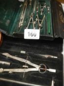 A quantity of mathematical tools including drawing compasses etc.