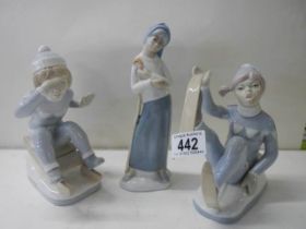 Three Lladro style figures.