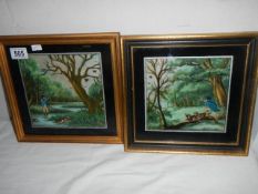 A pair of framed and glazed hunting scenes on silk.