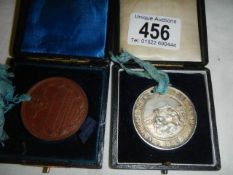 Two cased 19th century Nottingham School Board attendance medallions.