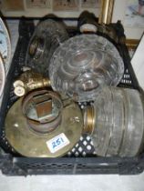 A quantity of oil lamp fonts etc.,