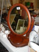 An oval Victorian mahogany toilet mirror, COLLECT ONLY.
