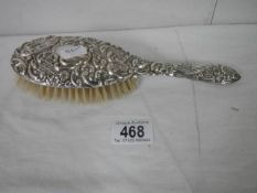 A silver backed hair brush,