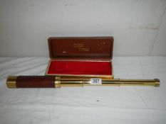 A cased brass telescope, 30 x 40, marked Japan.