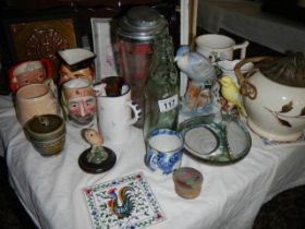 A mixed lot including Toby jugs, cocktail shaker, cod bottle etc.,
