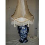 A good quality pottery table lamp with shade.