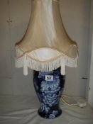 A good quality pottery table lamp with shade.