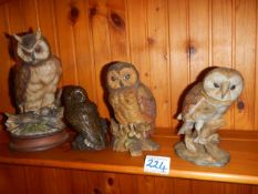 Four owl figures.