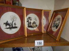 Four framed and glazed silhouettes.