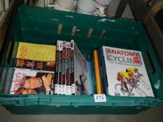 A box of books on exercise/sport