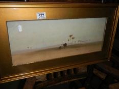 A framed and glazed watercolour desert scene signed J F Canham 1912, COLLECT ONLY.
