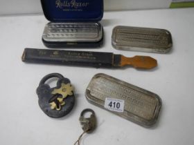 Three Rolls razors, a Razor strop and two vintage padlocks.