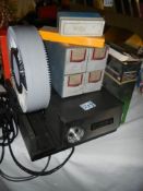 A slide projector, slide box etc.,