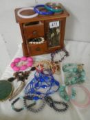 A jewellery box and costume jewellery.