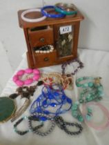 A jewellery box and costume jewellery.