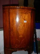 A marquetry inlaid corner cupboard. (53cm x 37cm x 78cm high) COLLECT ONLY.