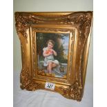 A gilt framed and glazed study of a child.