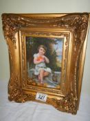 A gilt framed and glazed study of a child.