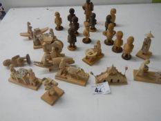 A collection of wooden figures including Chinese examples.