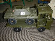 A toy military lorry and tank.
