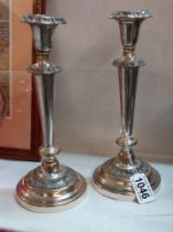 A pair of Sheffield plate candlesticks.