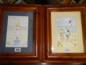 Two framed and glazed watercolours of children on the beach, 42.5 x 35 cm. COLLECT ONLY.