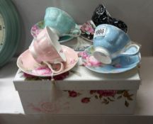 A set of 4 boxed London boutique fine porcelain cups and saucers